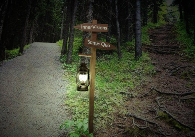 Two pathways in the woods. Left pathway is wide and clear of debris. Right pathway is littered with debris, dark and appears challenging. In the center of the two pathways is a sign post. InnerVisions points to the left, the innervisions lantern logo lightens the path. Status quo points to the right.